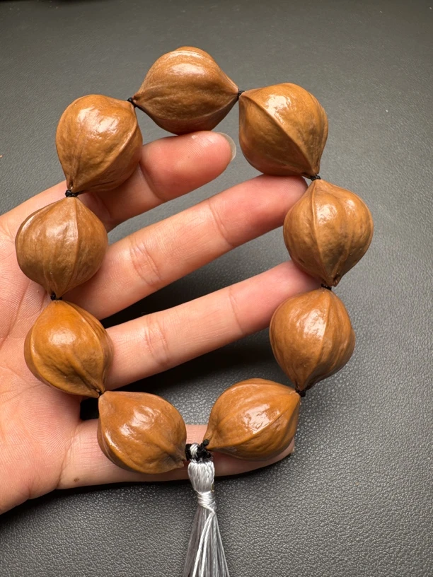 橄榄核雕2.3尺寸扁四花铁核素串《异形核福利款》