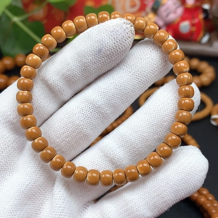 笙***吖橄榄核吊坠6.3老挝核尖正三花火焰纹单圈