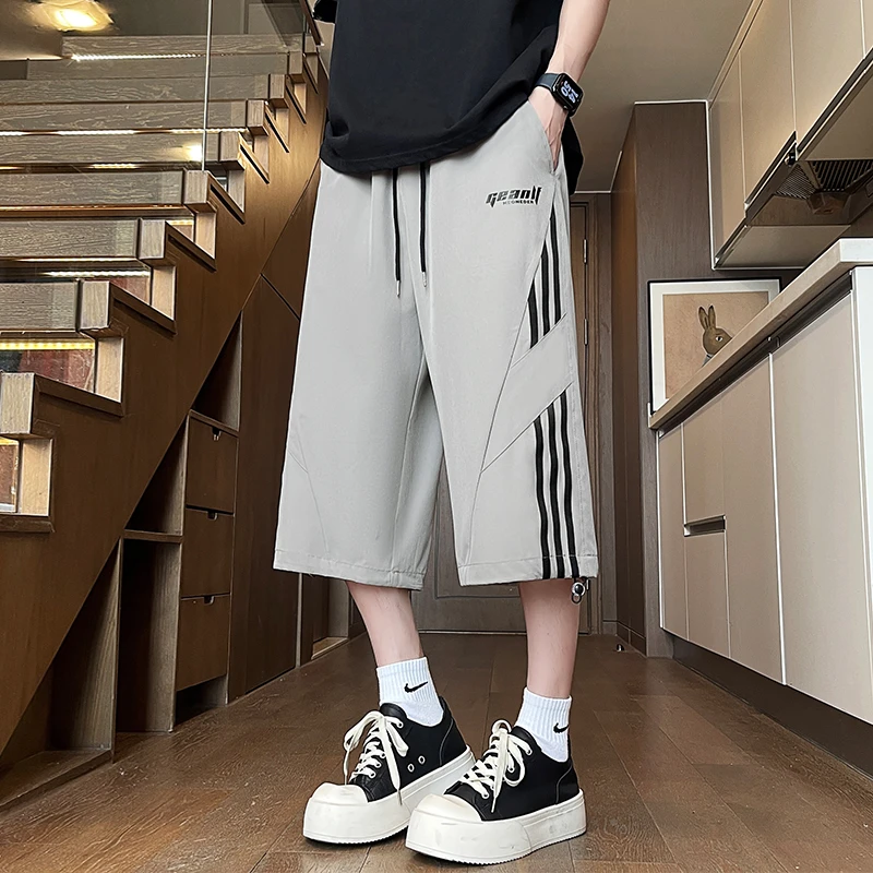 休闲冰丝短裤男夏季速干运动裤子男潮牌青少年条纹拼接直筒七分裤