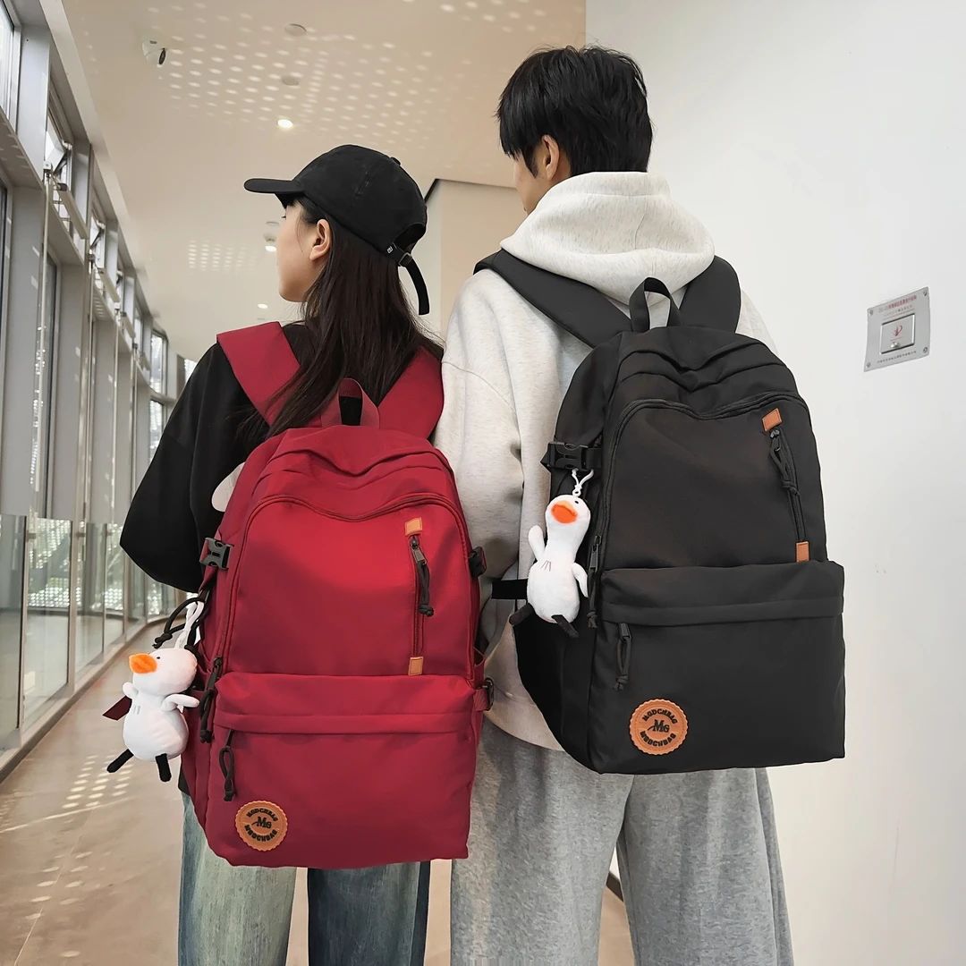 减负护脊纯色双肩包男女中学生大容量高中生书包女大学生简约背包