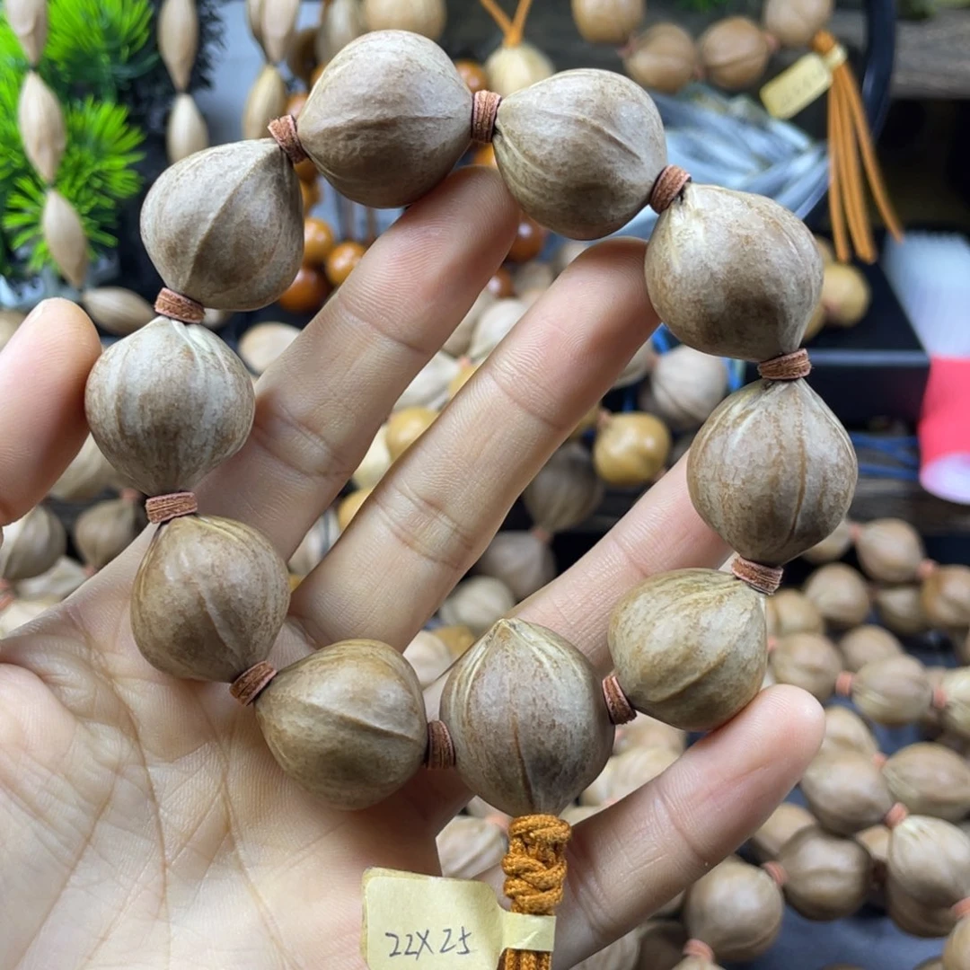 珍***生吊坠橄榄核22x25红核