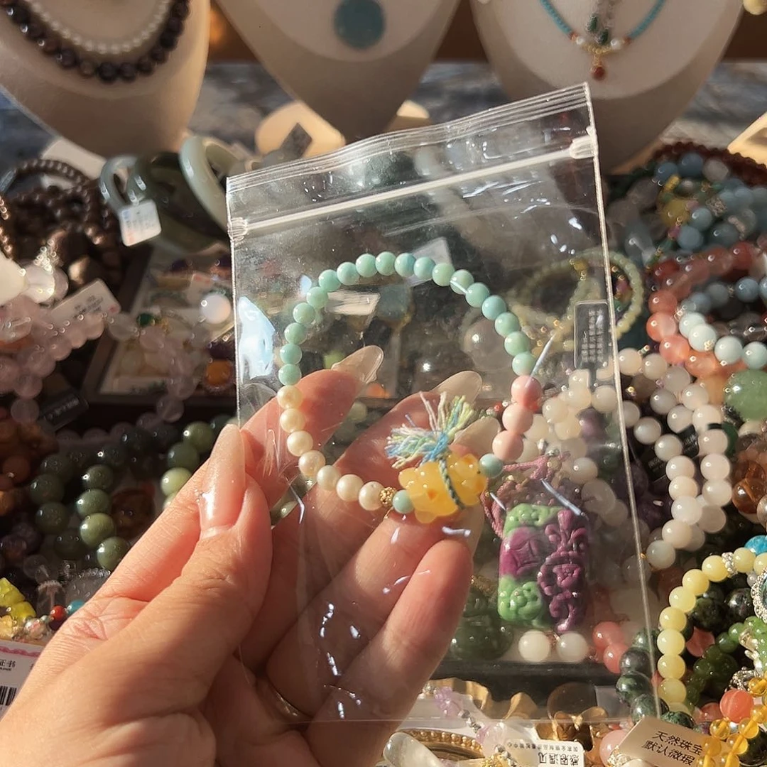 足银镶嵌针钠钙石（海纹石）手链阿**?