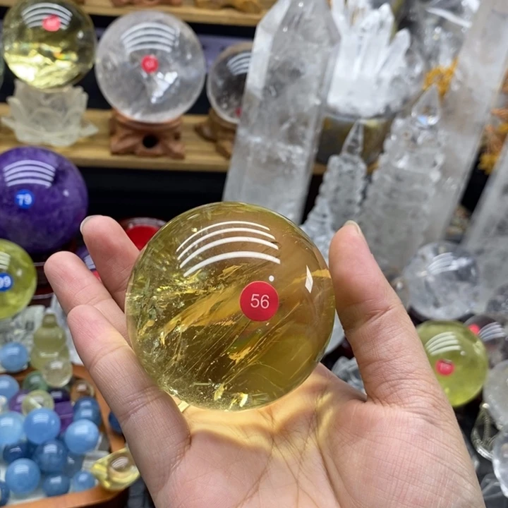 牟***菇石材天然黄水晶球