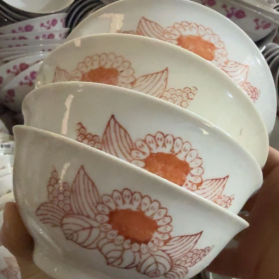 碗娜***?4个向日葵 有矿点凸瓷不圆