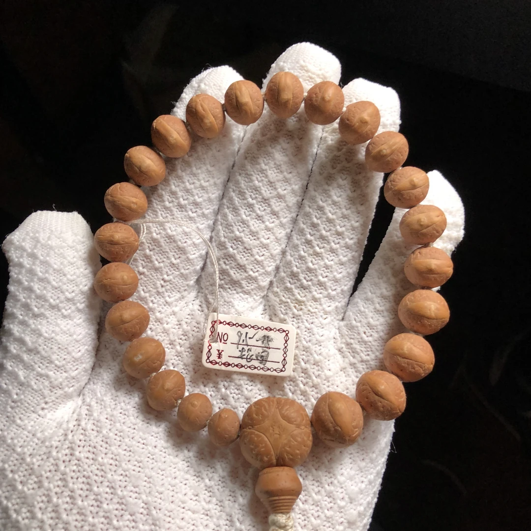 9.5～15mm实心籽轮回同树飞碟桩红皮尼泊尔小凤眼手串