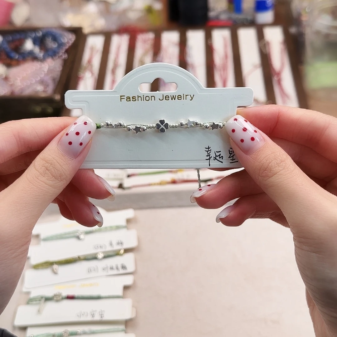 开***里银S925镶嵌手链烟晶幸运星