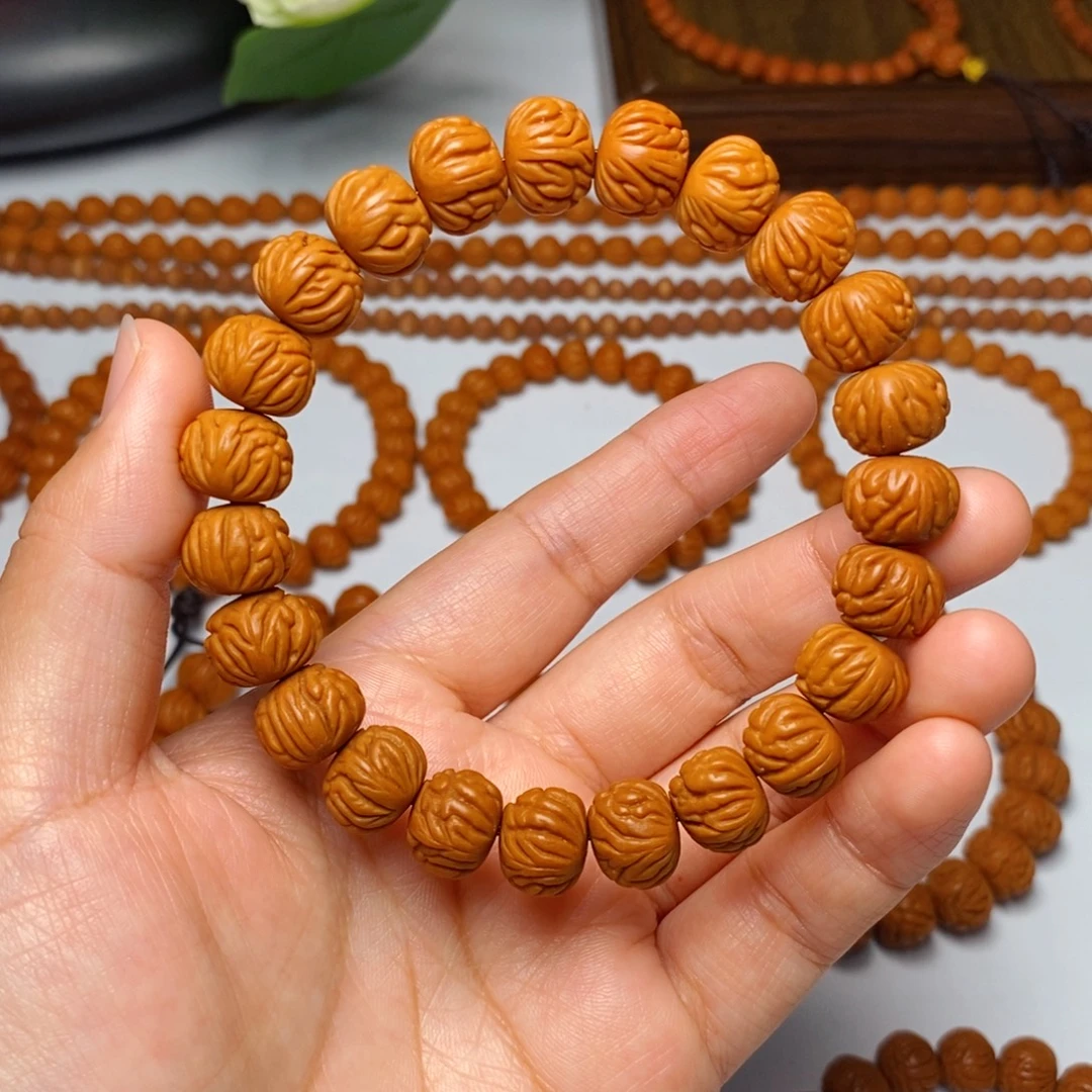 桃核手串12mm野生凤羽聚宝盆