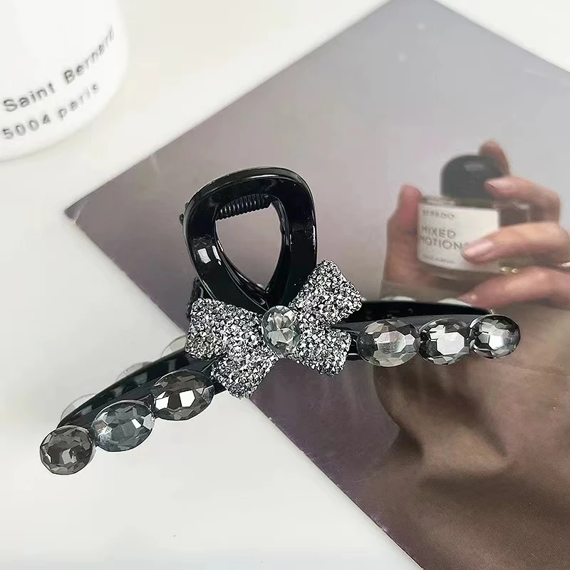 M2064夏季2025新款黑色蝴蝶结钻钻抓夹均码11公分百搭款