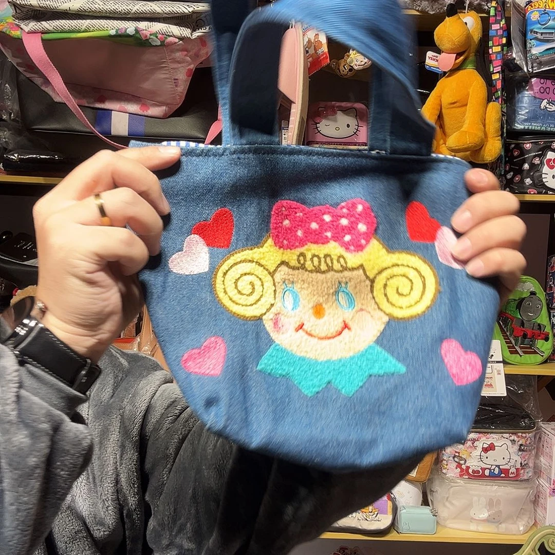 织物卷发女孩手提