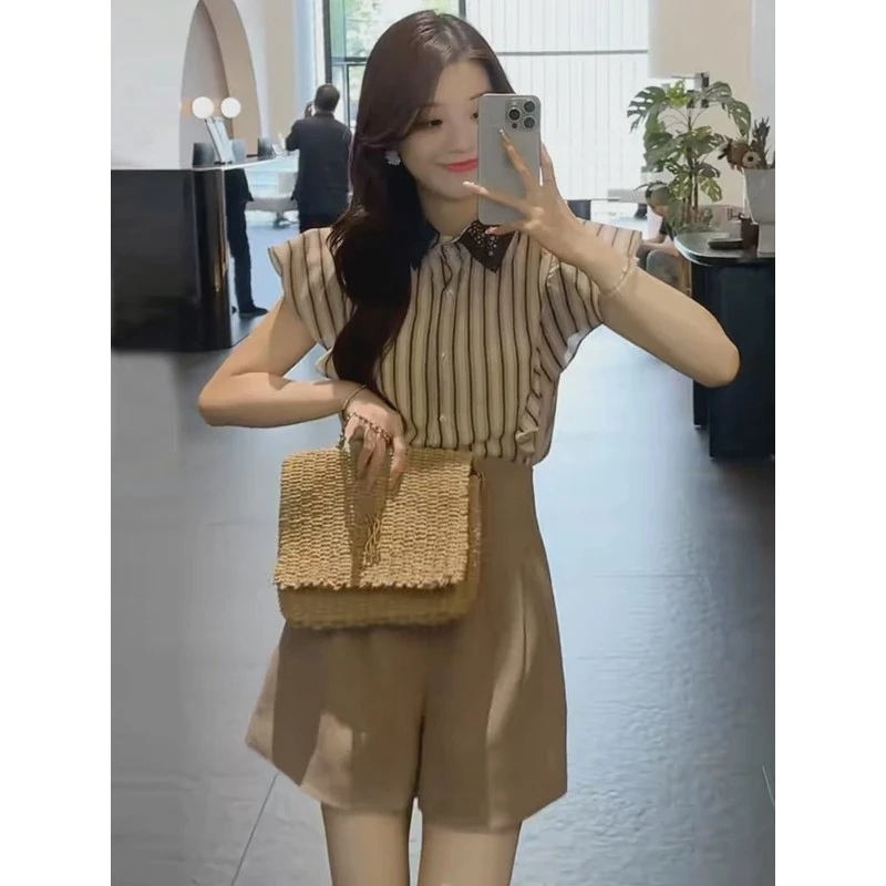 今年流行小飞袖衬衫女2025夏季新款时尚竖条纹宽松显瘦无袖上衣潮