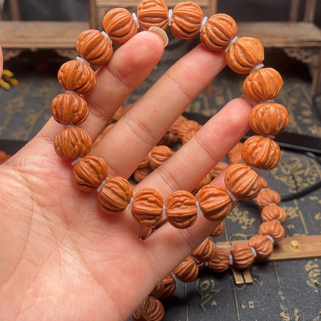 桃核吊坠佛手手串