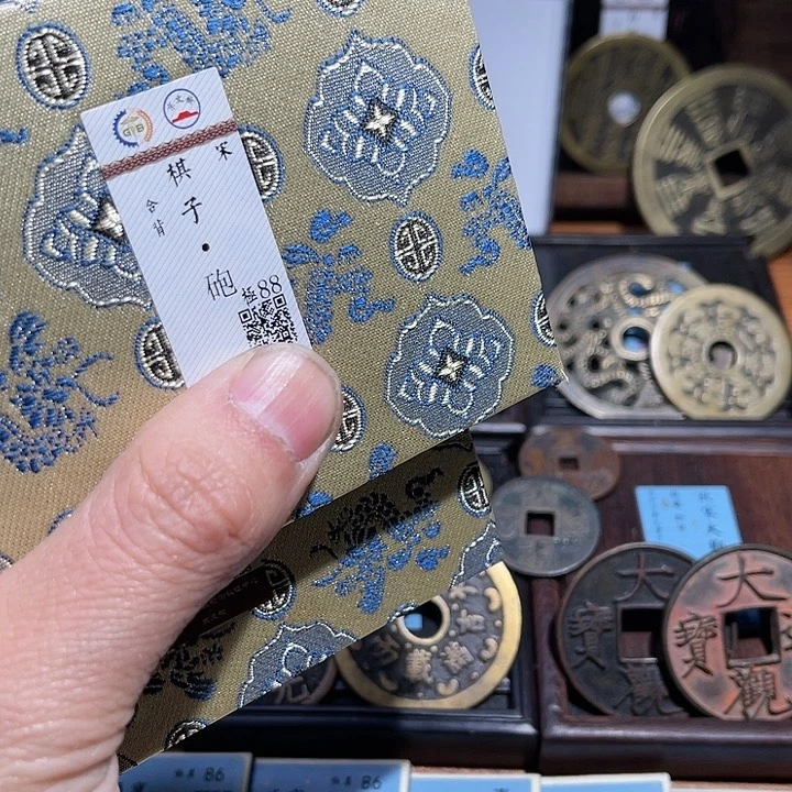 铜哈*三义棋钱两枚如图