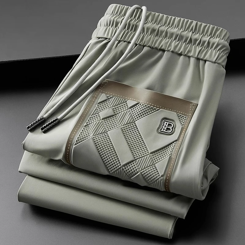 轻奢夏季薄款冰丝滑弹力休闲运动裤男修身高端欧货小脚九分裤男士