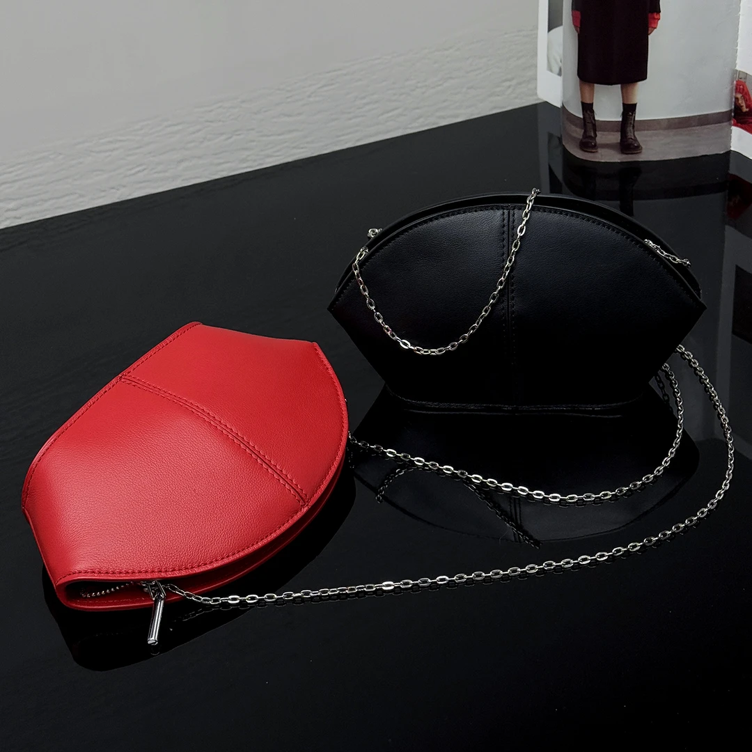 JISHE即奢时尚优雅弧形贝壳头层牛皮手拿包拉链开合晚装包