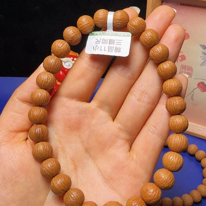 万***和猴头核桃吊坠凤羽