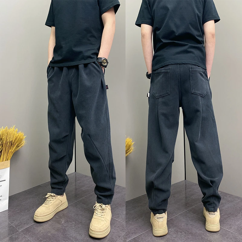 秋冬季2025简约纯色哈伦裤青年韩版宽松掐折哈伦裤爆款黑色卫裤子