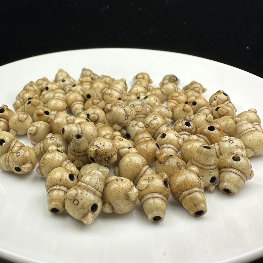 N067全玉化老料驼骨小熊三通10+mm