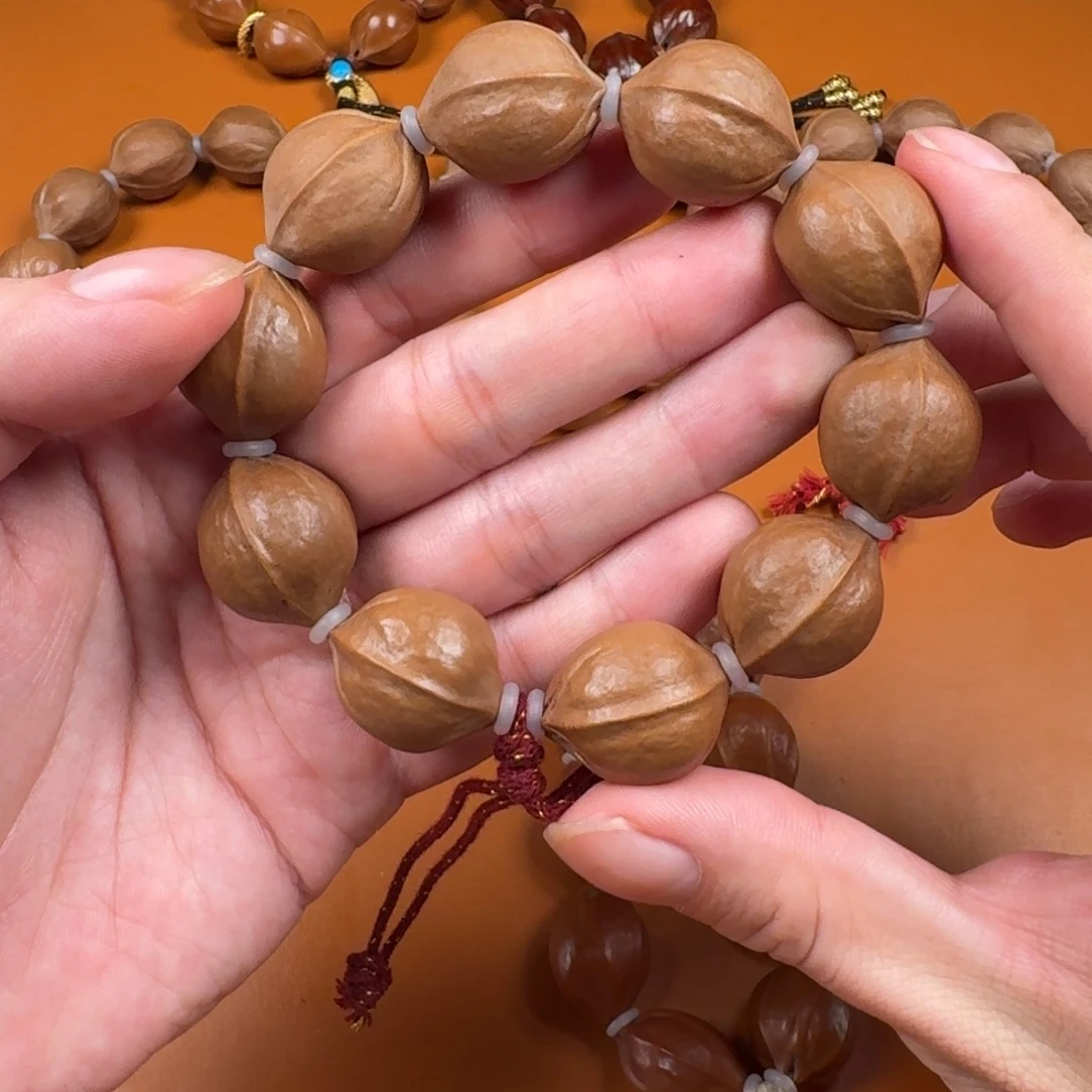 橄榄核手串19.24边肚同尺