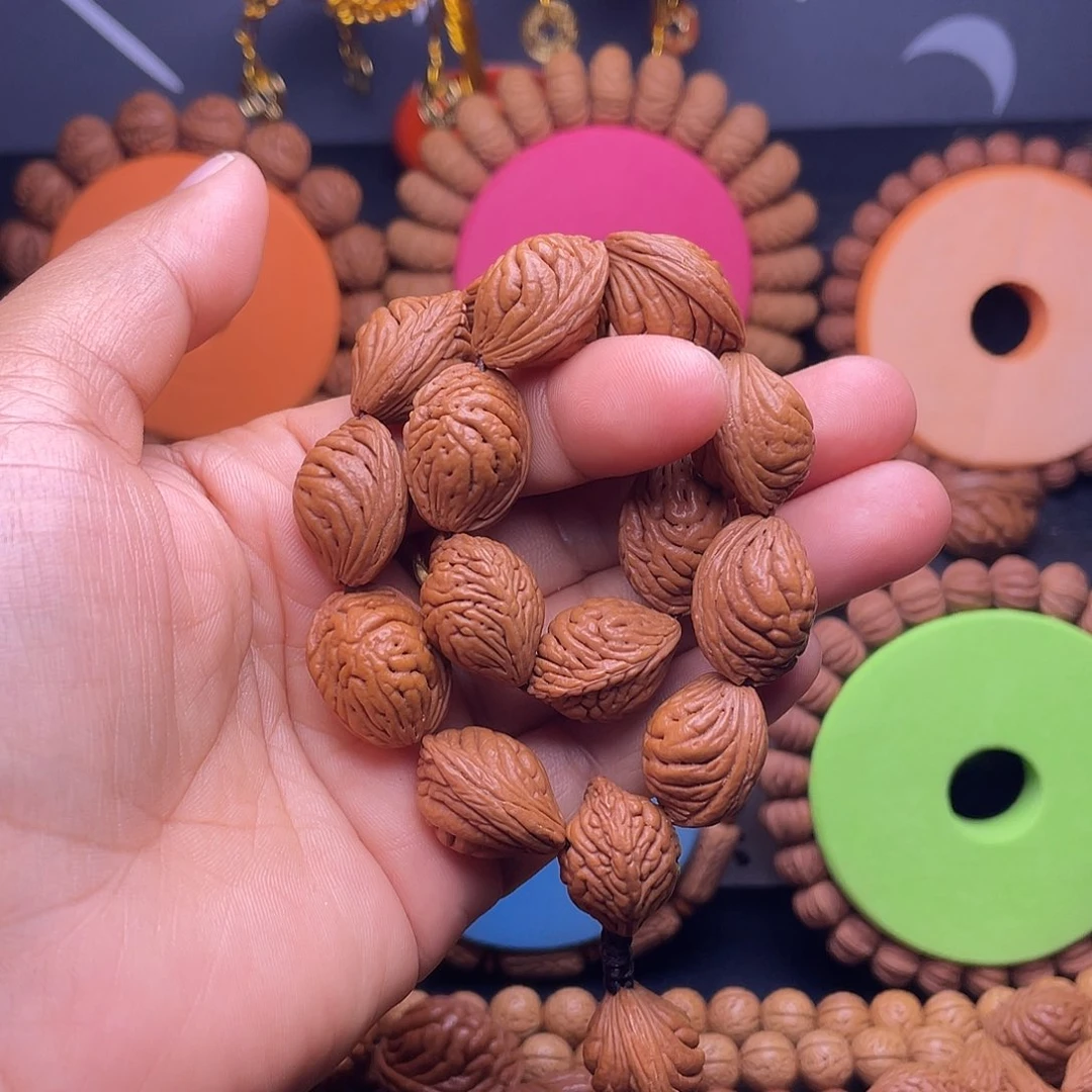 黑***牛桃核吊坠秦岭桃枭手串17颗籽