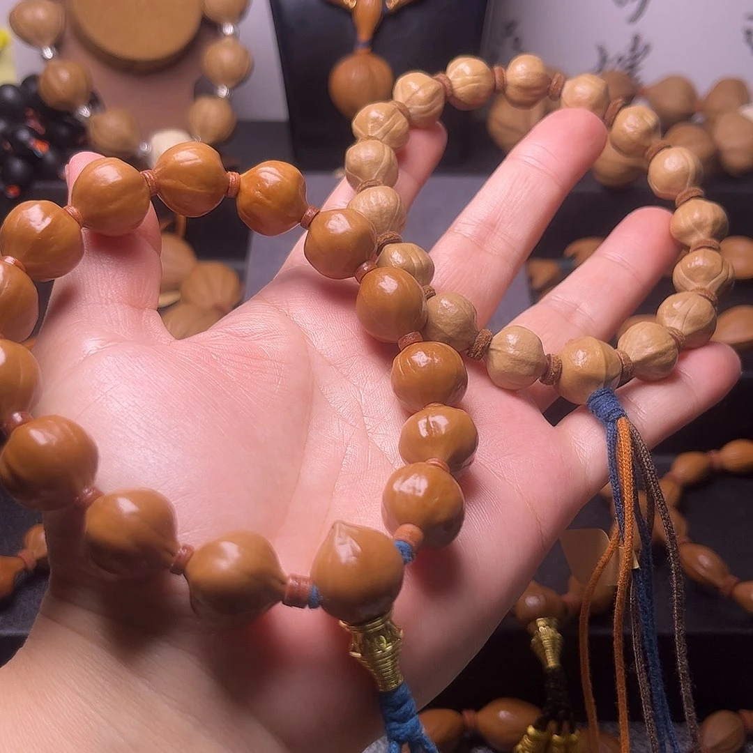 梵***东橄榄核手串蜜桃臀两条12和15