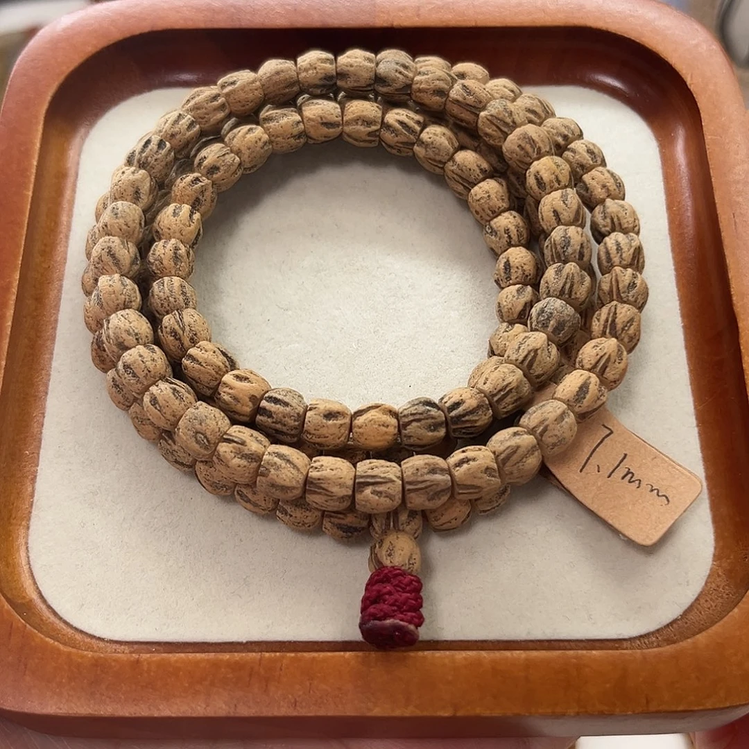 苏***宇柏香籽/百香籽吊坠A002卡7.1mm