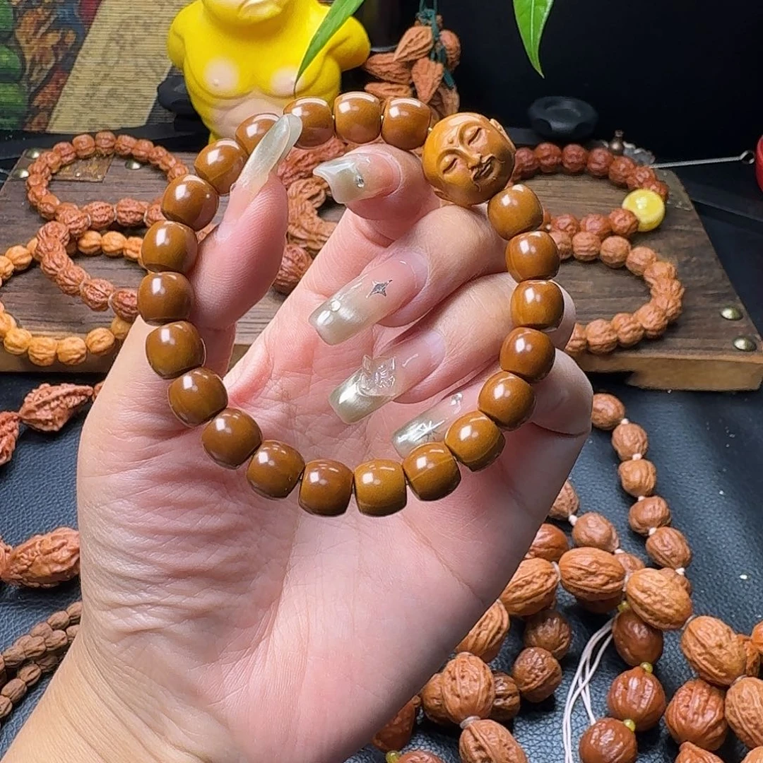 喜***的桃核手串光珠手串
