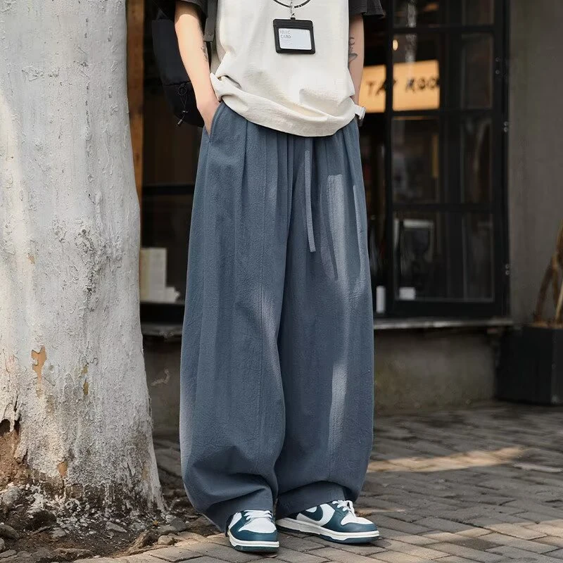 特大码300斤日系弯刀休闲裤男春秋季宽松痞帅运动垂感阔腿长裤子