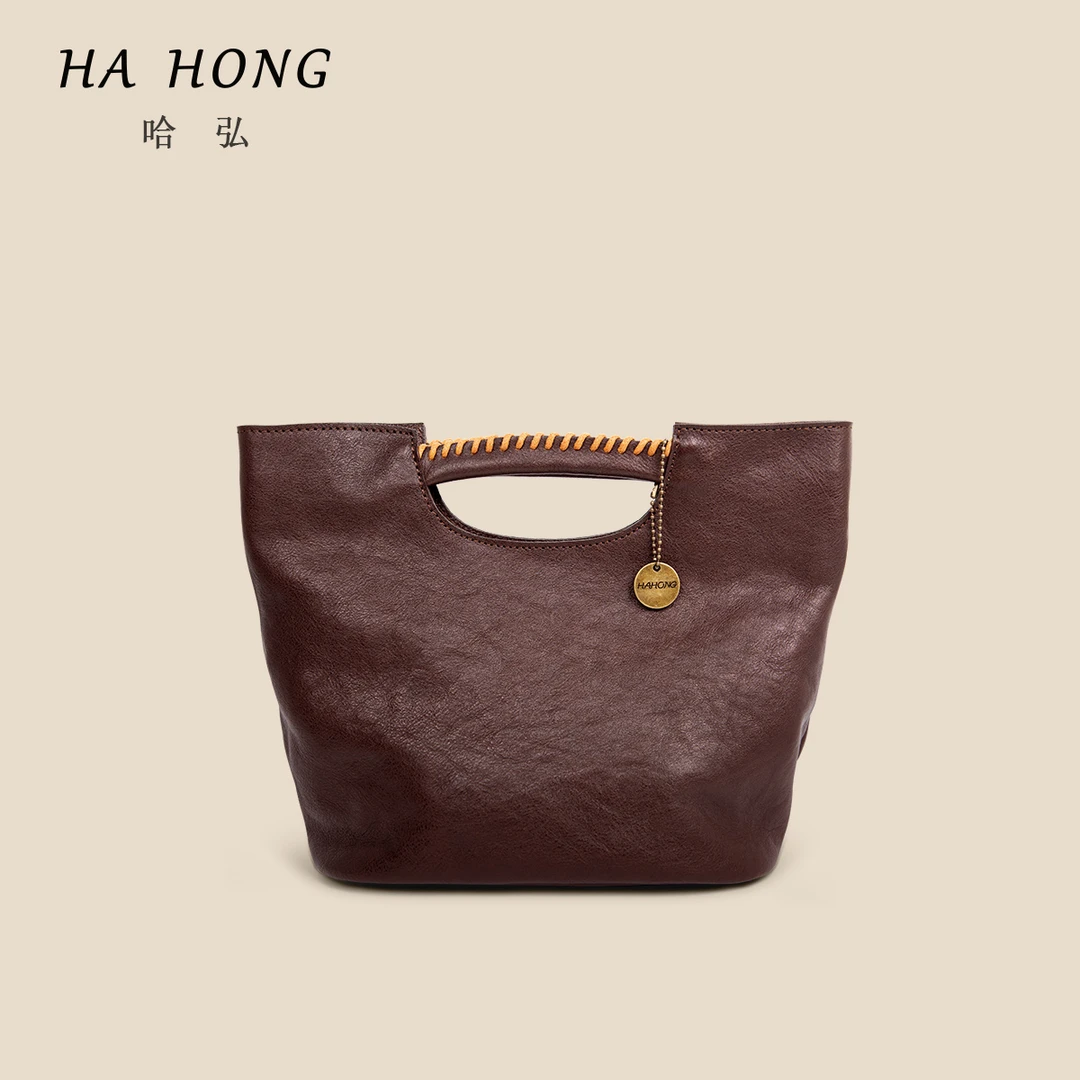 哈弘植鞣头层牛皮可单肩可斜挎包水桶包大容量手提包简约大气