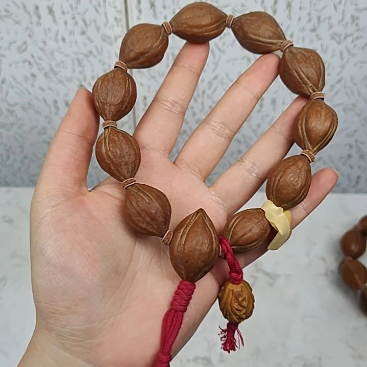 曼***文橄榄核吊坠2028四花手串