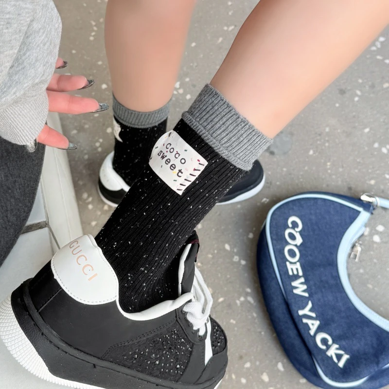 2025秋冬新款个性潮袜拼色后跟布标粗针袜点子纱堆堆袜子女中筒袜