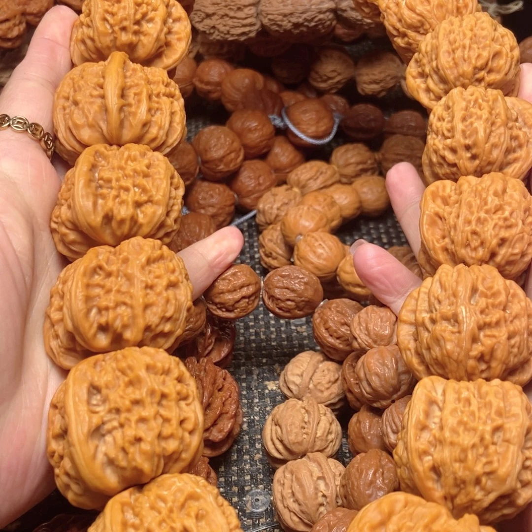 于***君吊坠桃核白狮子麻核桃手持