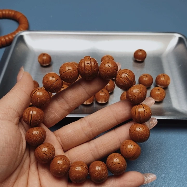 怣****》桃核手串极限圆15花皮色差16颗