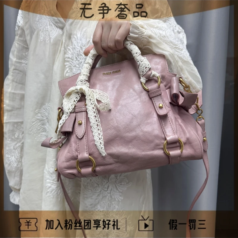 95新 MIU MIU/缪缪 油蜡皮蝴蝶结粉色手提斜挎包