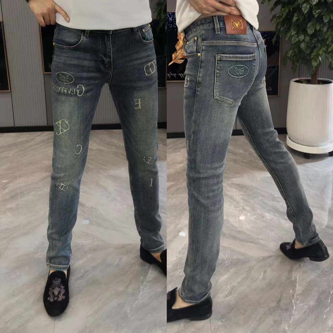 男士牛仔裤时尚字母烫钻修身水洗小脚裤秋季新款简约百搭长裤帅气
