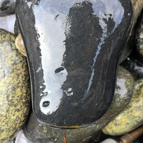 用***9藏玉药王石原石一个黑包公