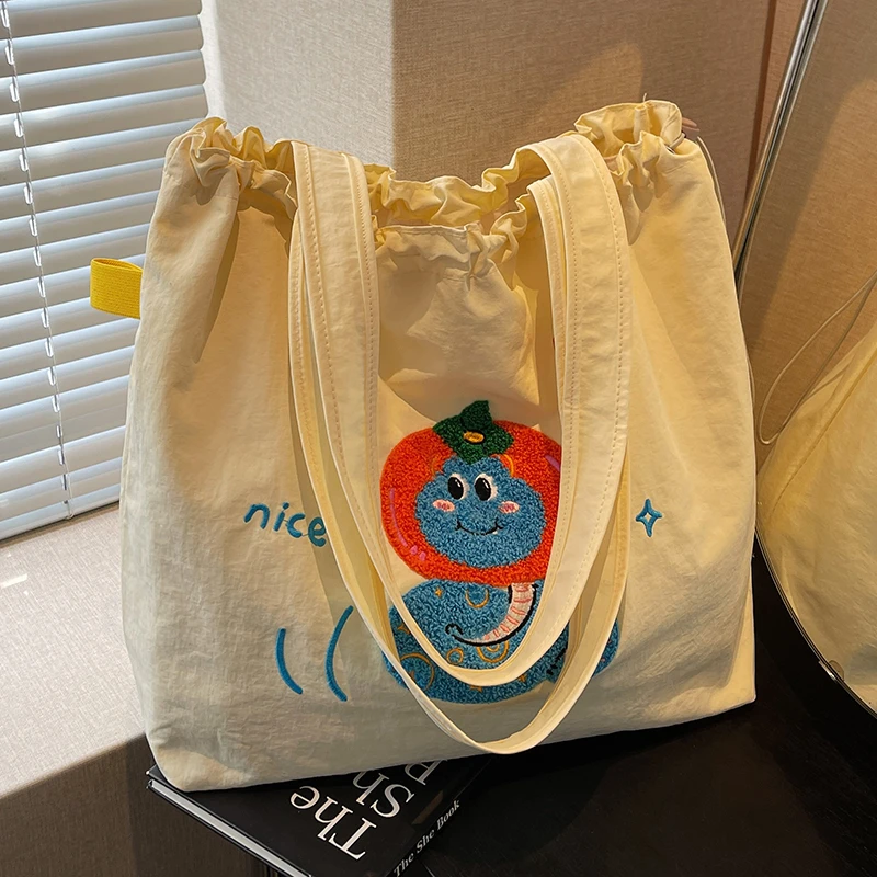 大容量托特包包女2025新款可爱小蛇帆布包百搭学生上课通勤单肩包