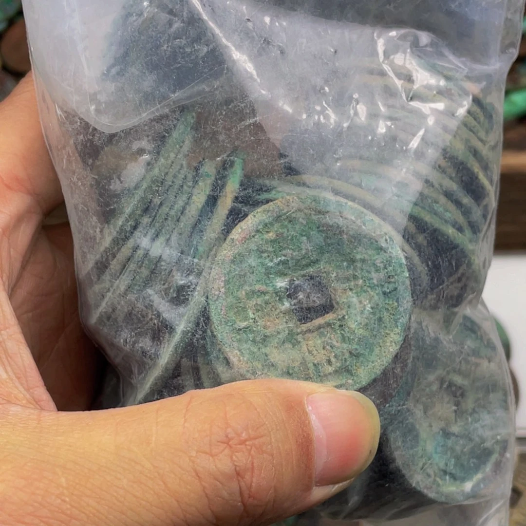 用**白五十个崇宁通宝送7个