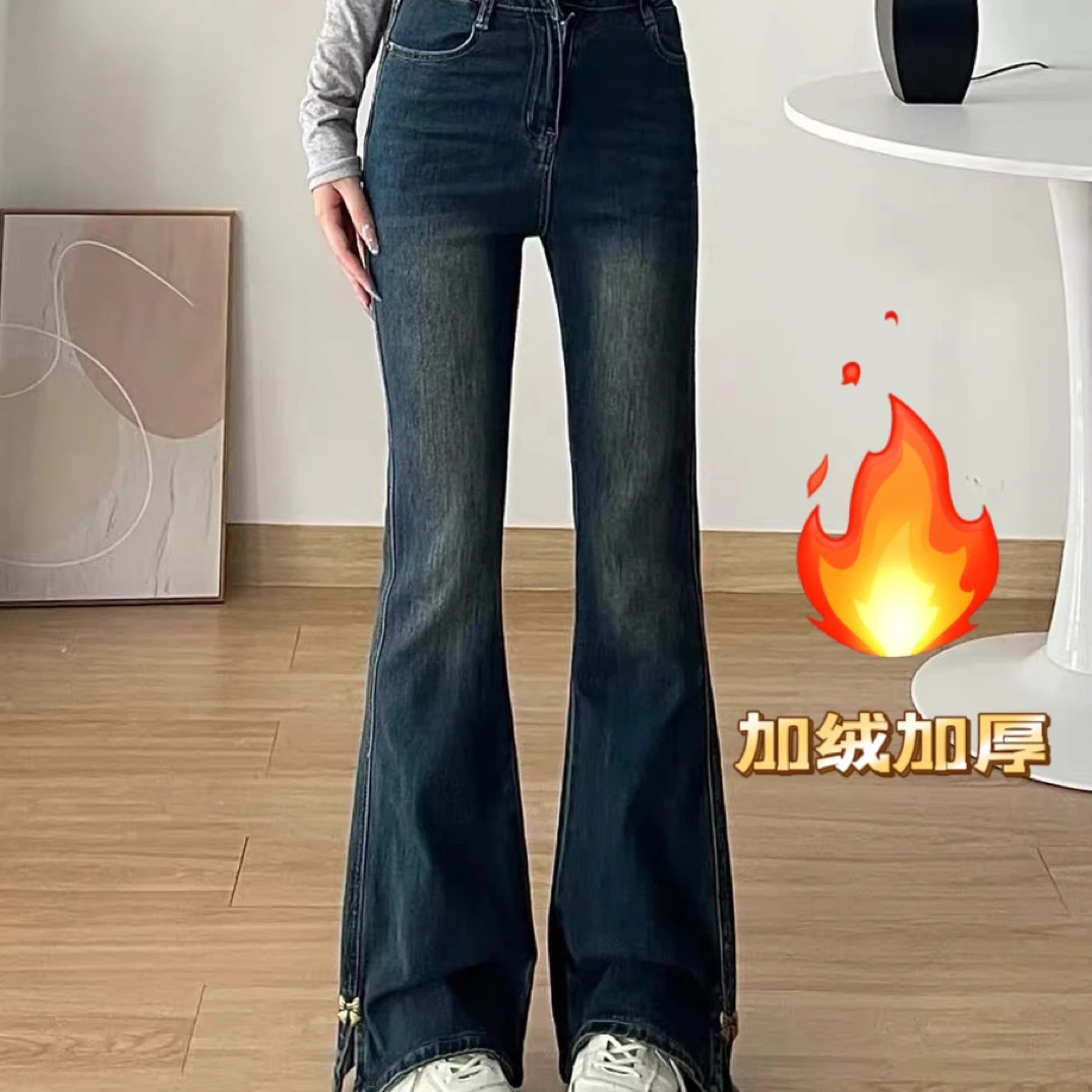 深蓝色开叉蝴蝶结微喇弹力牛仔裤女2025秋冬加绒显高显瘦