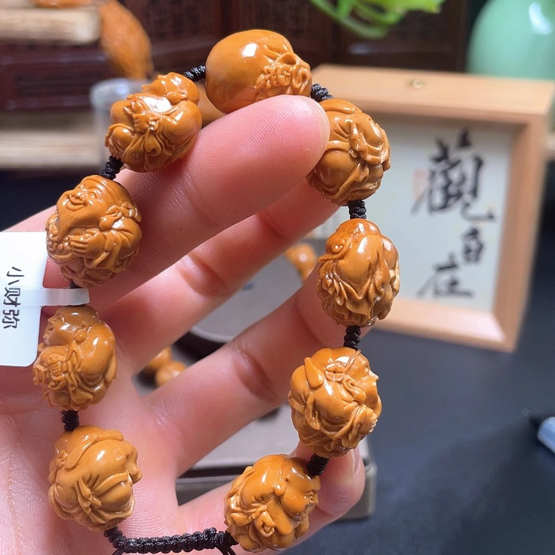 橄榄核吊坠处**然橄榄核