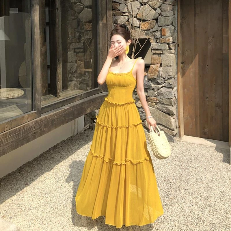 纯欲漂亮独特黄色吊带连衣裙女夏季高级性感露背海边度假沙滩长裙
