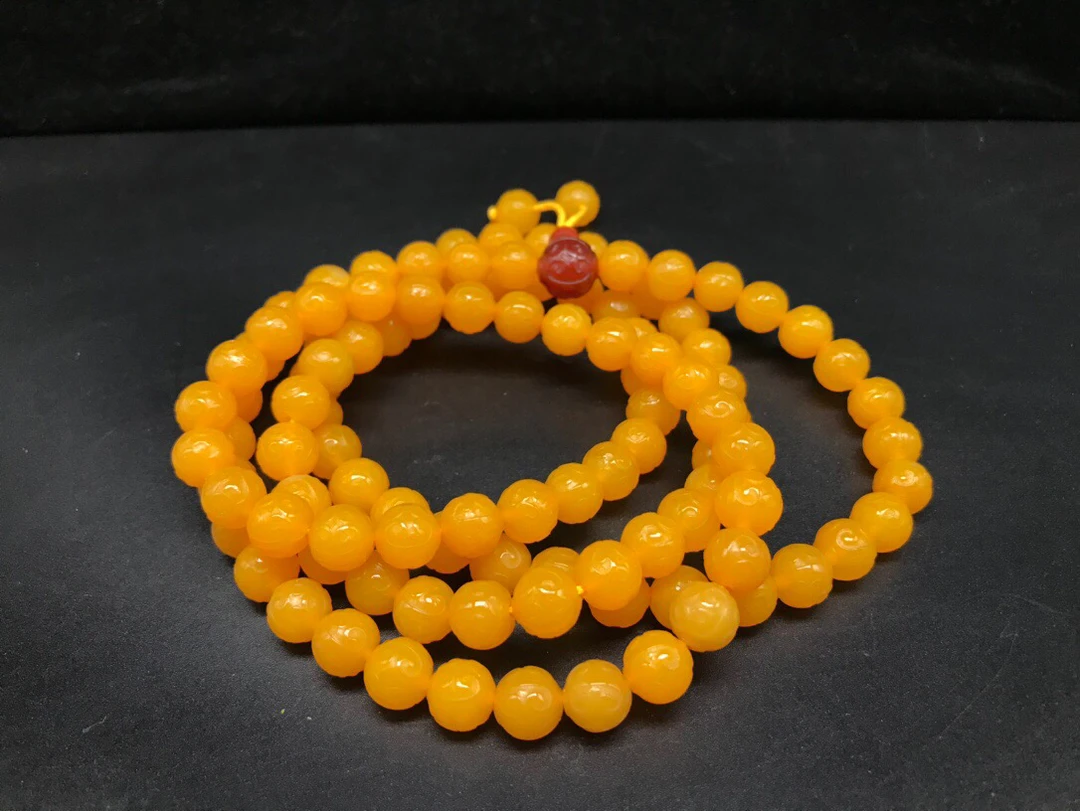 鸡油黄玛瑙如意纹108颗佛珠