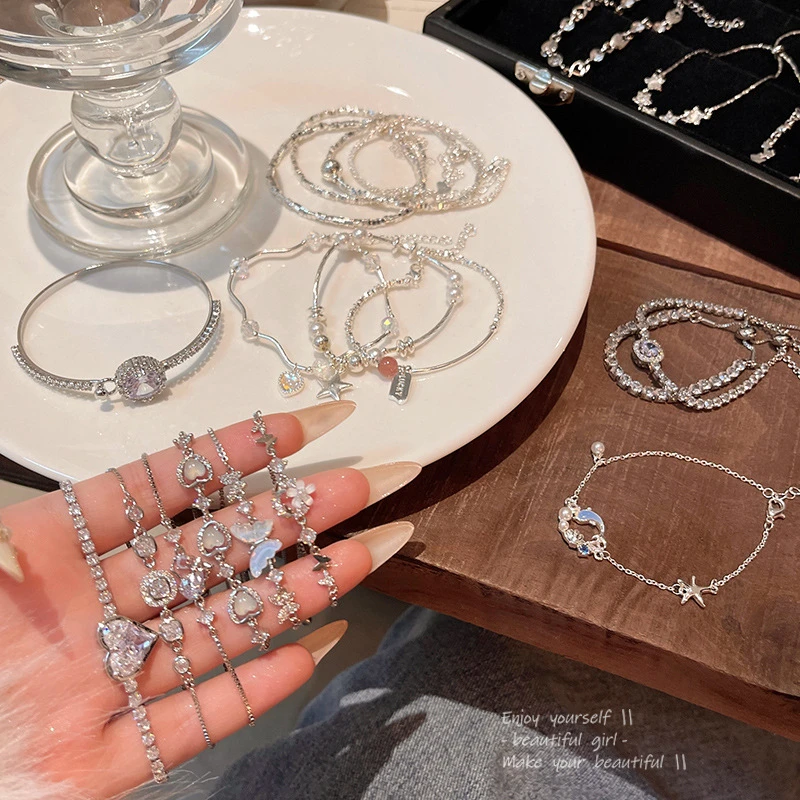 铜合金亚克力手链 韩系爆款高级感珍珠手链女精致锆石爱心蝴蝶结