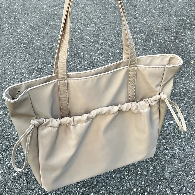 大容量托特包包女2025新款尼龙布学生上课简约轻便通勤电脑单肩包