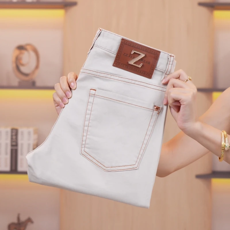 香槟杏牛仔裤男士夏季薄款潮流弹力九分裤高端时尚修身小直筒长裤