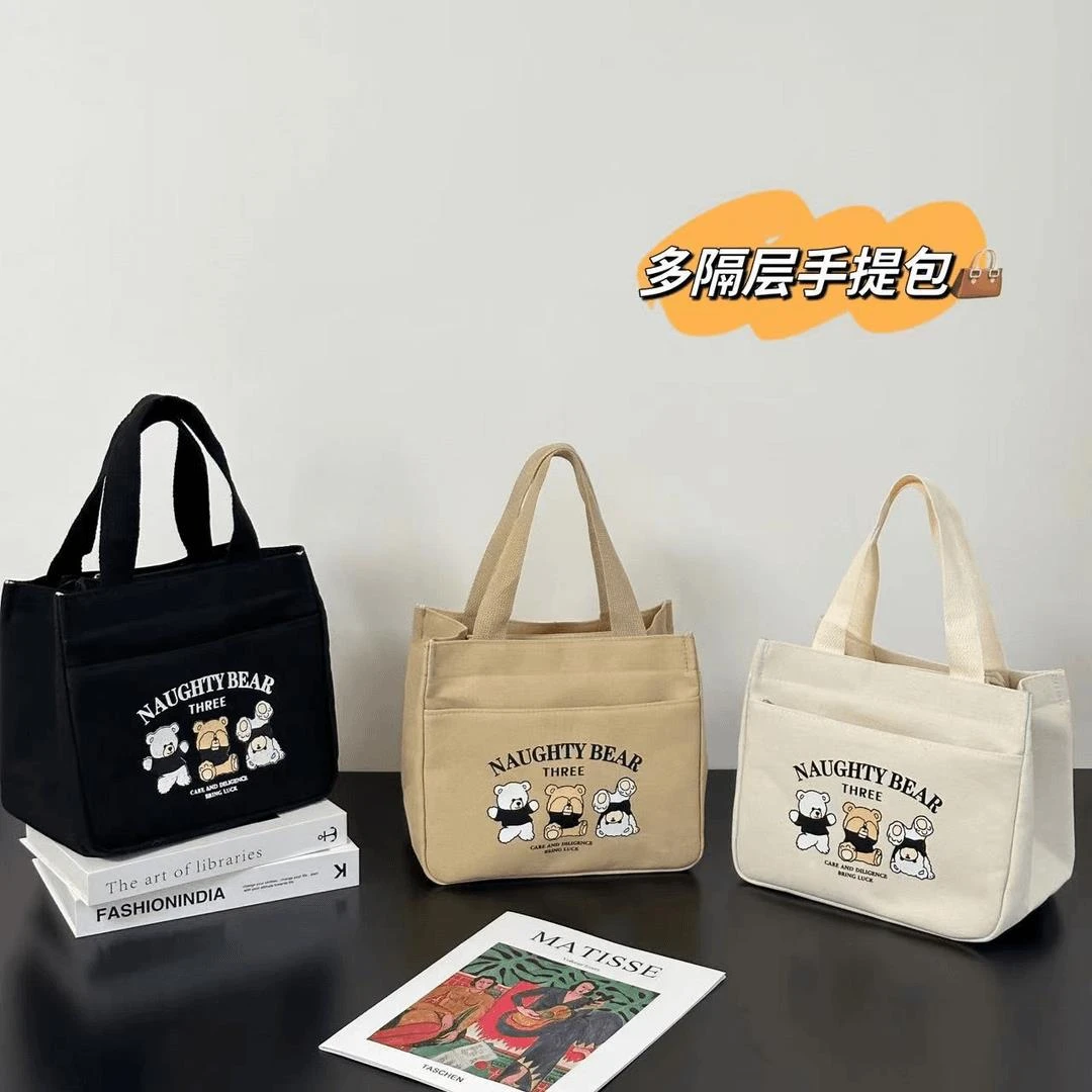 拉链外侧兜帆布手提包多口袋妈咪包卡通便携饭盒包通勤女包零食包