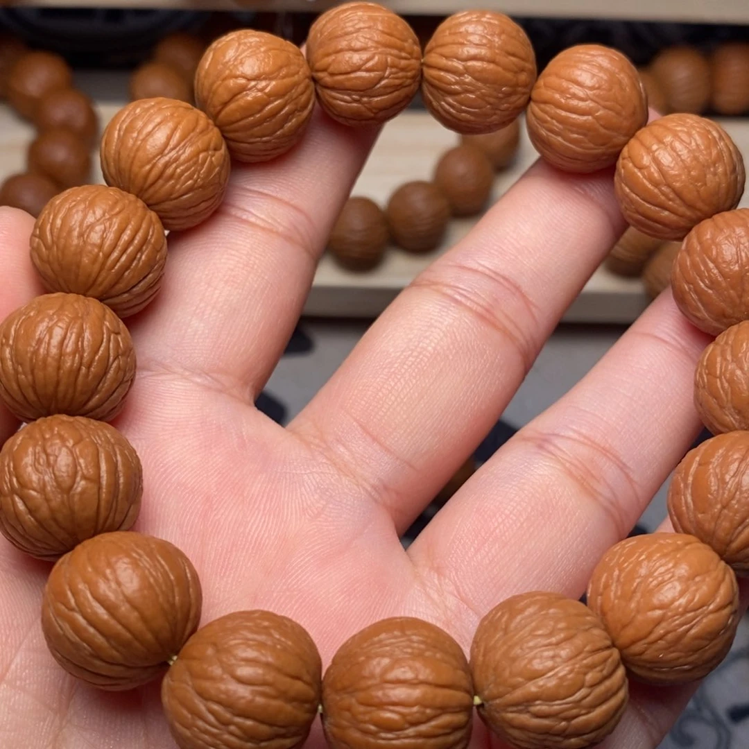 吊坠桃核凤羽手串