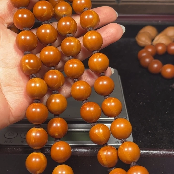 蒋****吊坠橄榄核1.37+铁核脖挂56颗