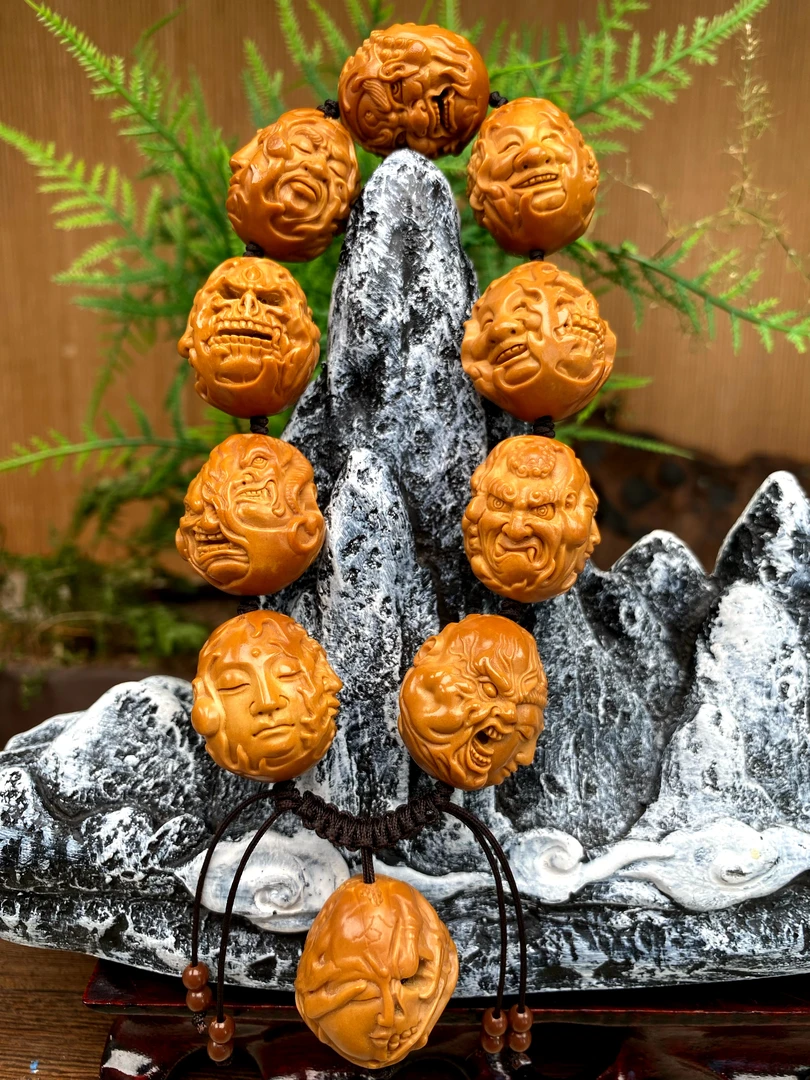 藏艺，四面天神恶僧橄榄核雕手串