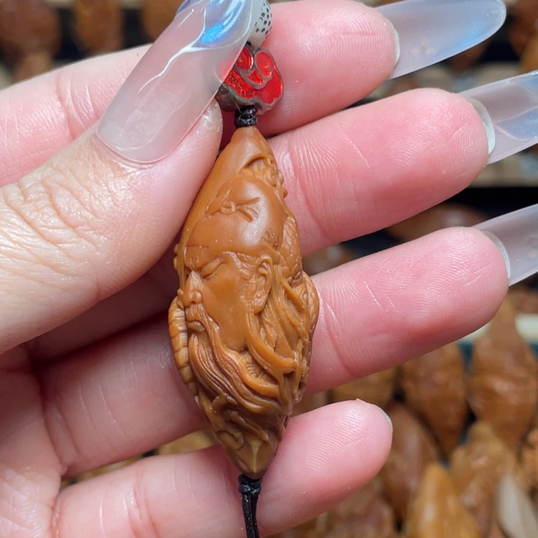 橄榄核把件关公头