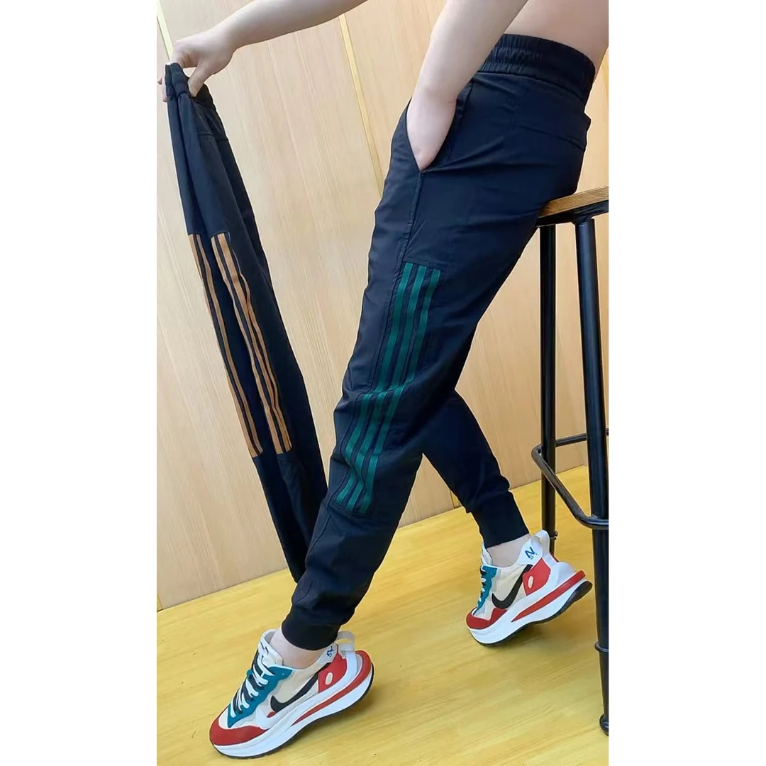 2025夏季薄款条纹速干休闲裤男冰丝小脚九分裤潮流百搭弹力哈伦裤